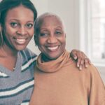 Daughter and mother smiling.