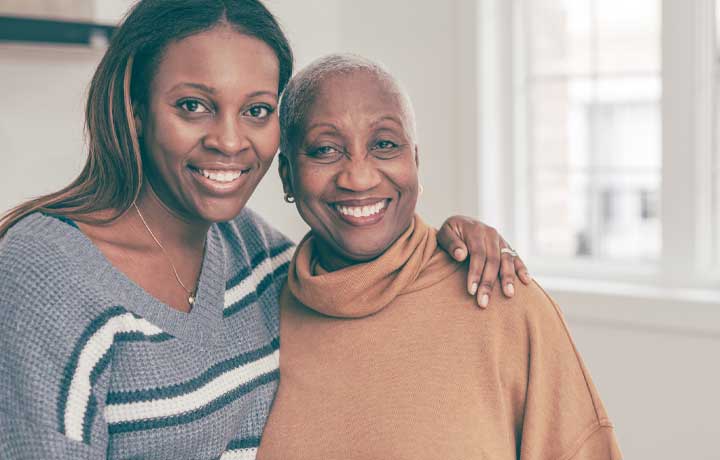 Daughter and mother smiling.