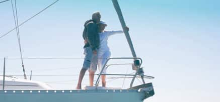 Older couple on their yacht.