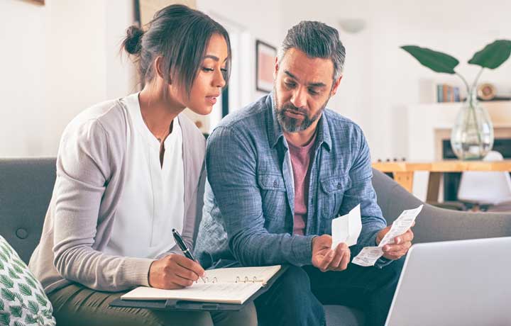 Mid life couple planning their expenses.